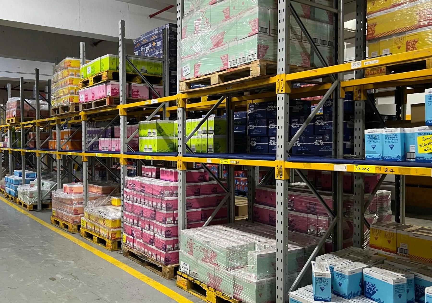 Inside the Synergy warehouse in Hong Kong, pallets of partner brands on racking